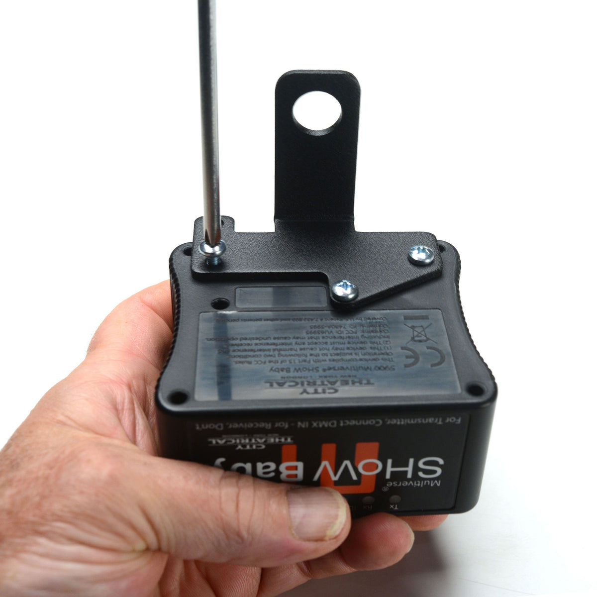 Multiverse SHoW Baby 5780 held in hand with mounting bracket being screwed to rear label panel, City Theatrical