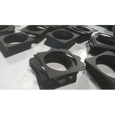 CITTHE 2330 color frame stacks on workbench showing black square gel frames with round apertures and mounting notches, City Theatrical