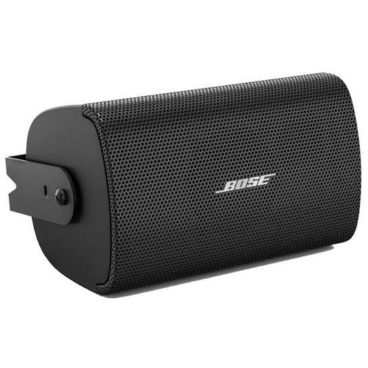 Bose AudioPack Pro black surface-mount loudspeaker at an angle with perforated grille and mounting bracket