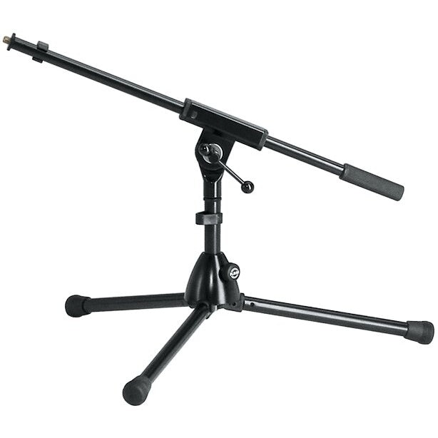 25910 extra low tripod mic stand front three-quarter view with boom arm extended, black finish, rubber-capped legs and grip-handled counterweight end, K&M