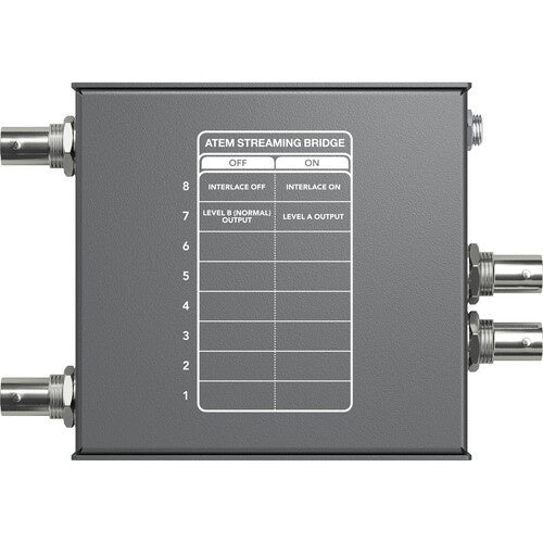 Blackmagic Design ATEM Streaming Bridge underside showing DIP switch setting chart for interlace and output level