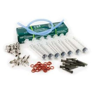 Water-Tight Connector Kit for Mini TX transmitters, 10-piece kit contents laid out: green box of 734 sealant, row of syringes, blue tubing, metal connector fittings, red O-rings and black tips, Lectrosonics