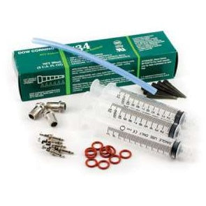 Water-tight connector kit for Mini TX mic sealing, contents laid out: Dow Corning 734 sealant box, three syringes, blue tubing, metal fittings, valve cores and red O-rings, Lectrosonics