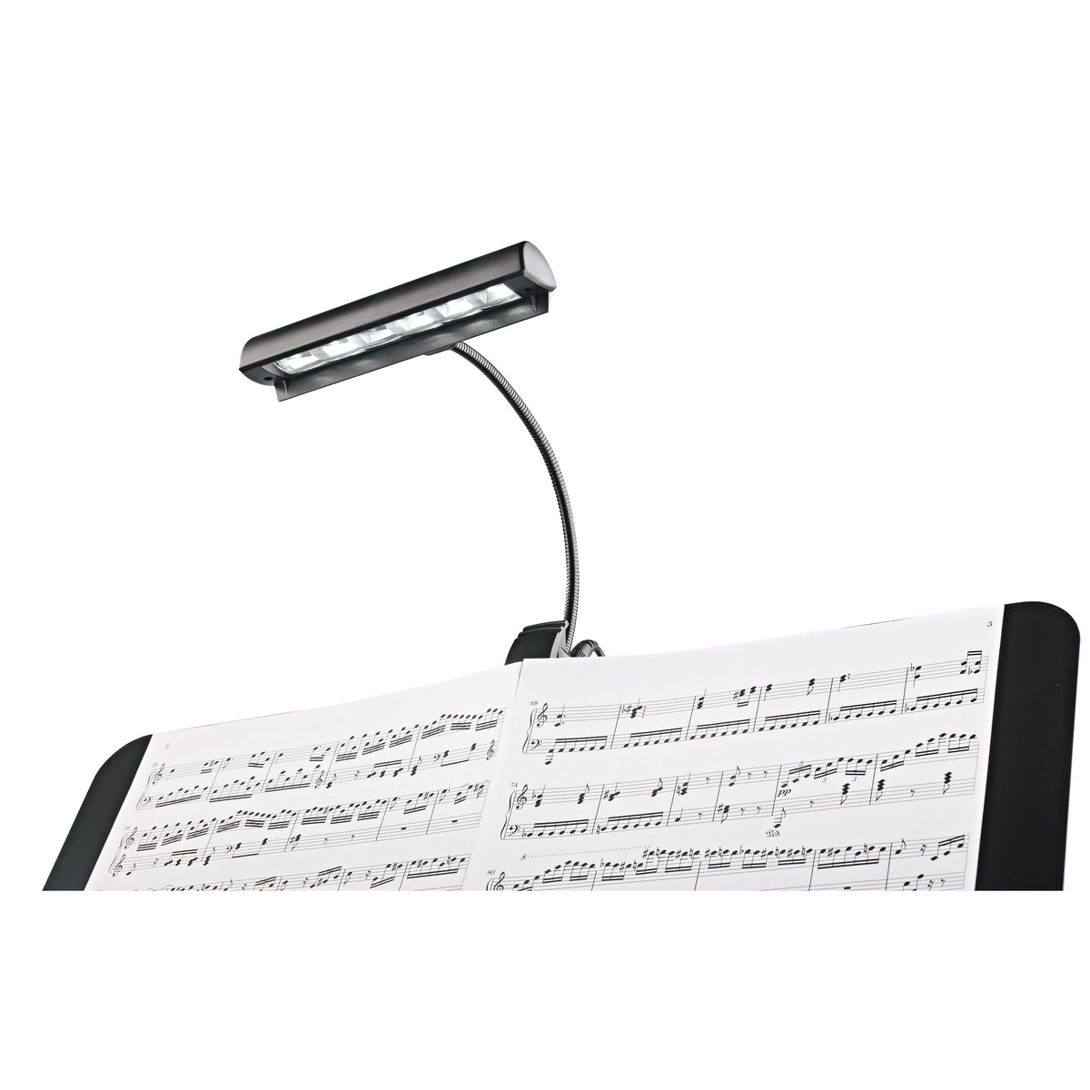 12248 Concert Orchestra music stand light clipped to a music stand illuminating open sheet music, K&M
