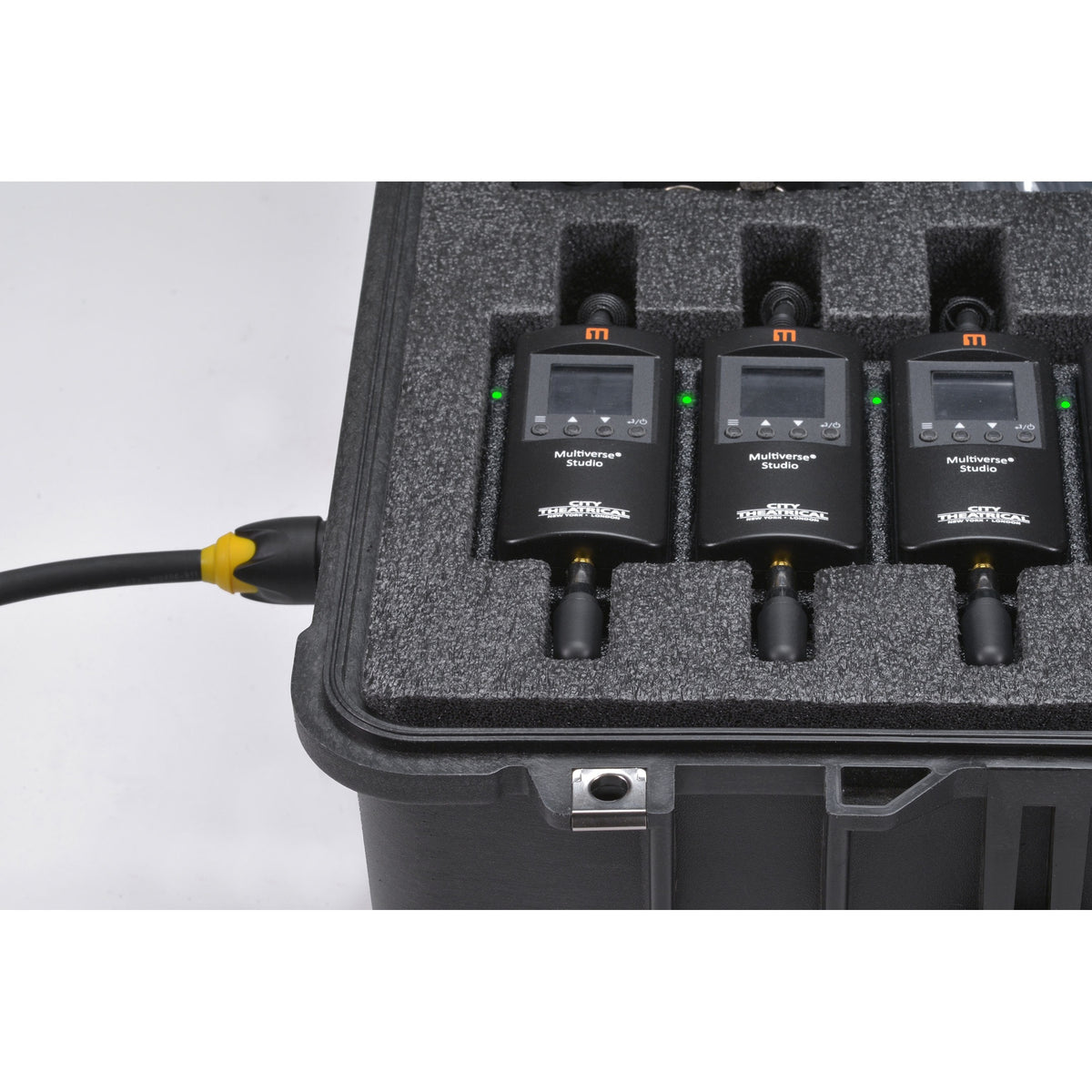 Multiverse Studio Kit 5938 charging in case, three Studio receivers with LCD displays and green status LEDs powered by TRUE1 cable, City Theatrical