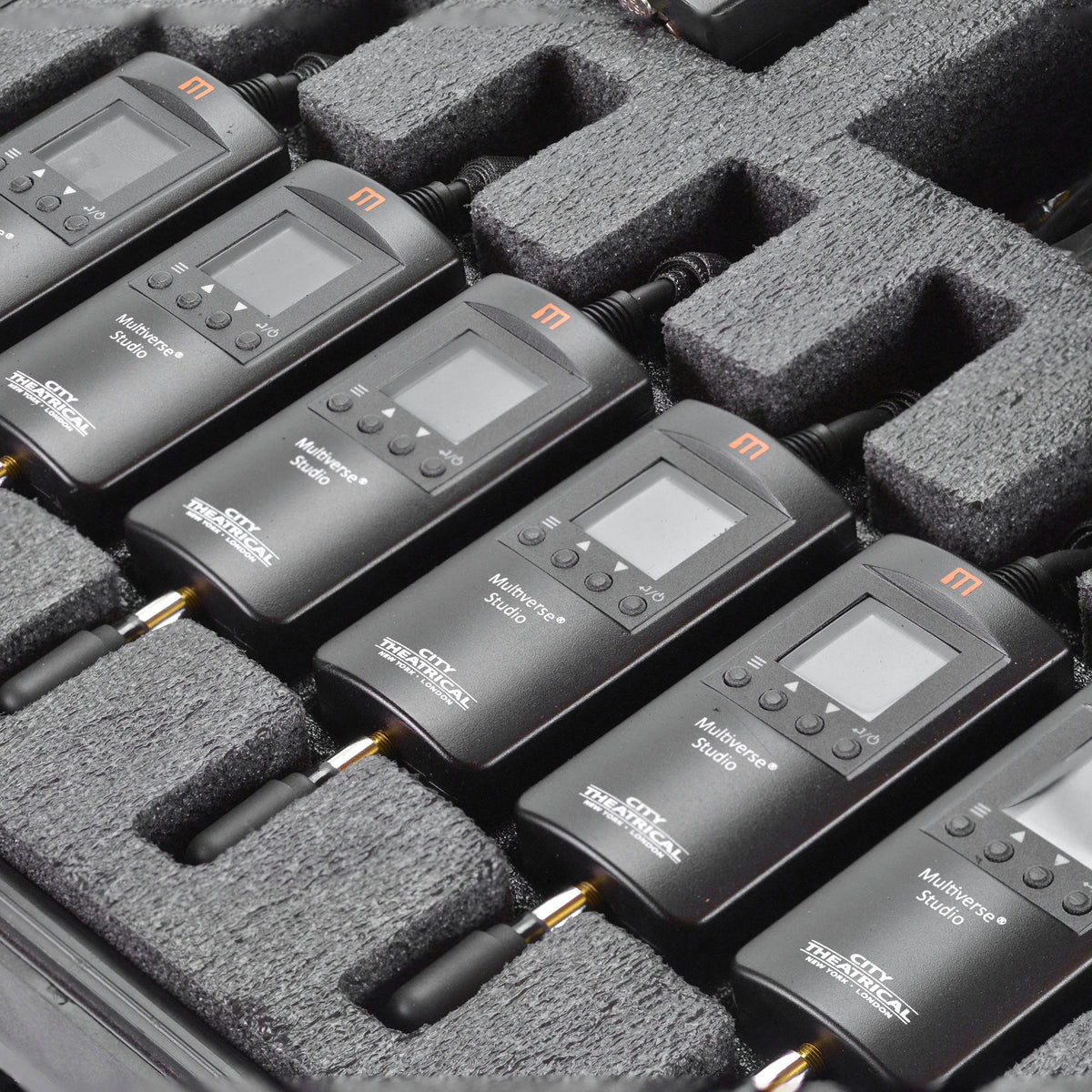 Multiverse Studio wireless DMX receivers close-up in kit foam cutouts with LCD screens, four-button menus and antennas, City Theatrical