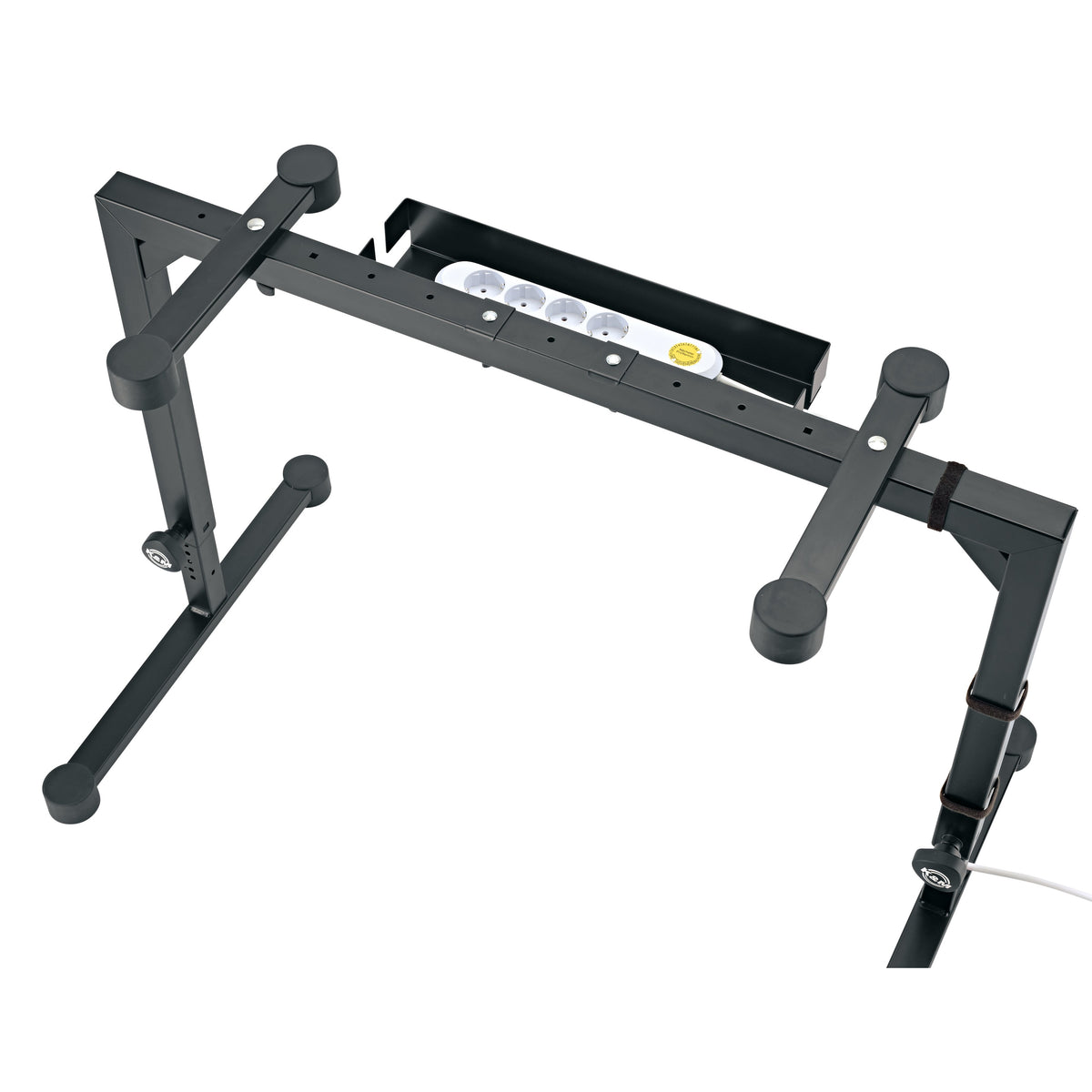 18808 cable organizer box attached to Omega stand crossbar with power strip seated inside and cable routed down the leg, K&M