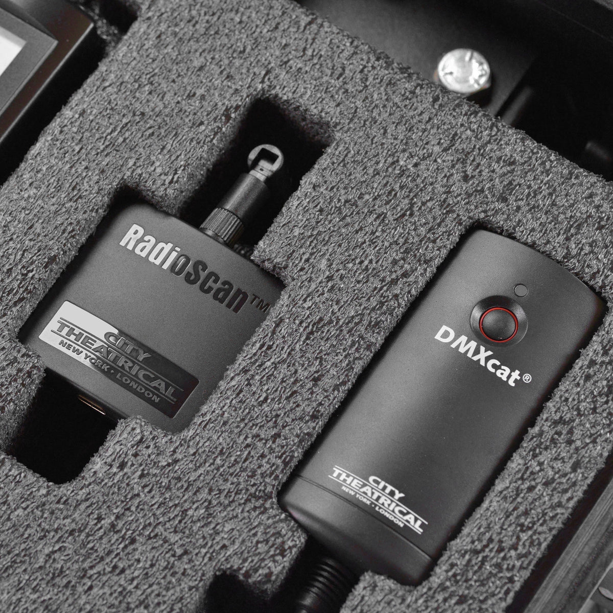 RadioScan spectrum analyzer and DMXcat interface stored side by side in Multiverse Studio Kit foam, City Theatrical