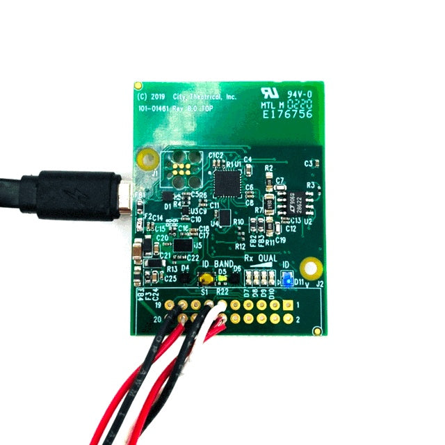 Multiverse 5906 receiver card top view with micro USB cable connected and red/black wire leads on the 20-pin header, City Theatrical