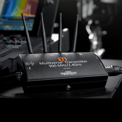 Multiverse Transmitter 5910 in use on a production desk with powerCON and Ethernet cables connected, City Theatrical
