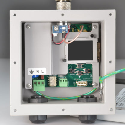 Multiverse Vero transceiver interior view with cover removed exposing DMX512 and 277V AC terminal blocks, LCD display and MENU/ENTER buttons, City Theatrical