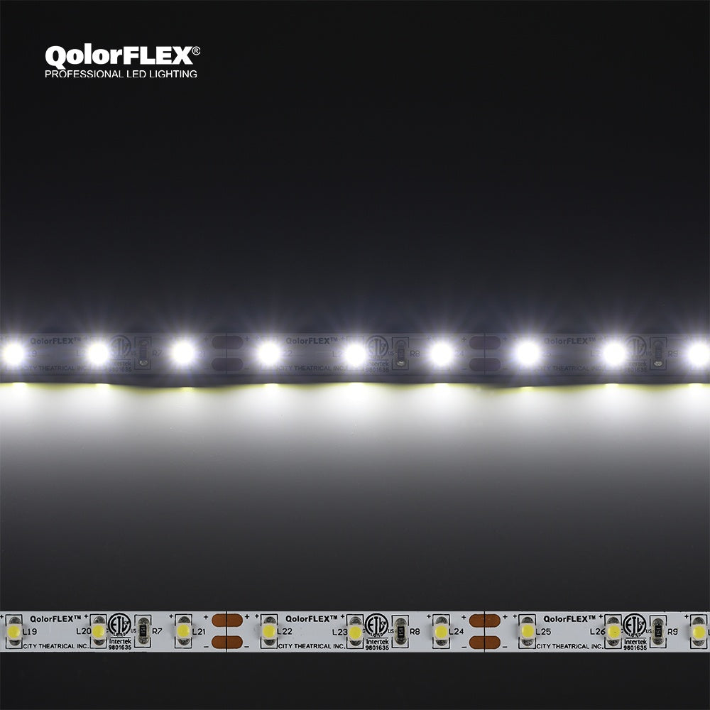 QolorFLEX 3528 LED tape illuminated in cool white above an unlit strip showing solder pads, cut marks and ETL marking, City Theatrical