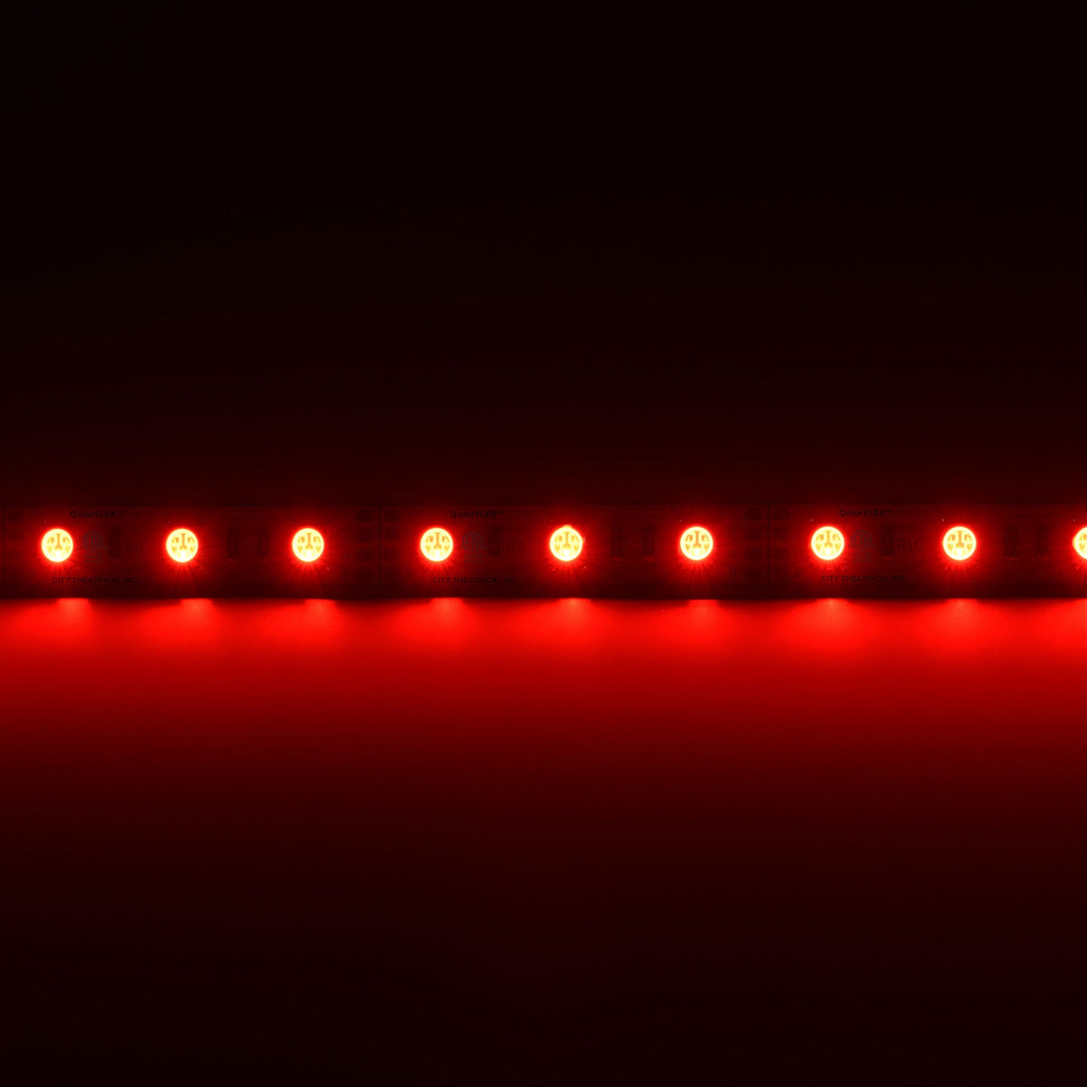 QolorFLEX 5050-12-RGBCW LED tape illuminated red, even spacing of 60 LEDs per meter against black, City Theatrical