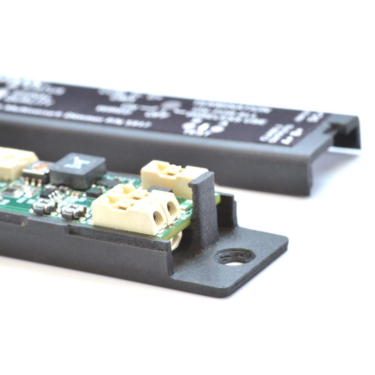 Multiverse 5916 2x2.5A dimmer opened up, close-up of green PCB with ivory screw terminal blocks and mounting flange, City Theatrical
