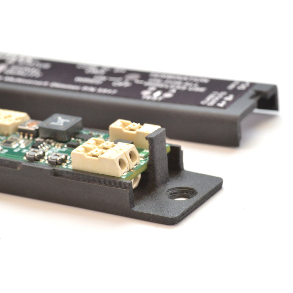 Multiverse 5916 dimmer with top cover removed beside chassis, showing terminal block wiring points and keyhole mounting tab, City Theatrical