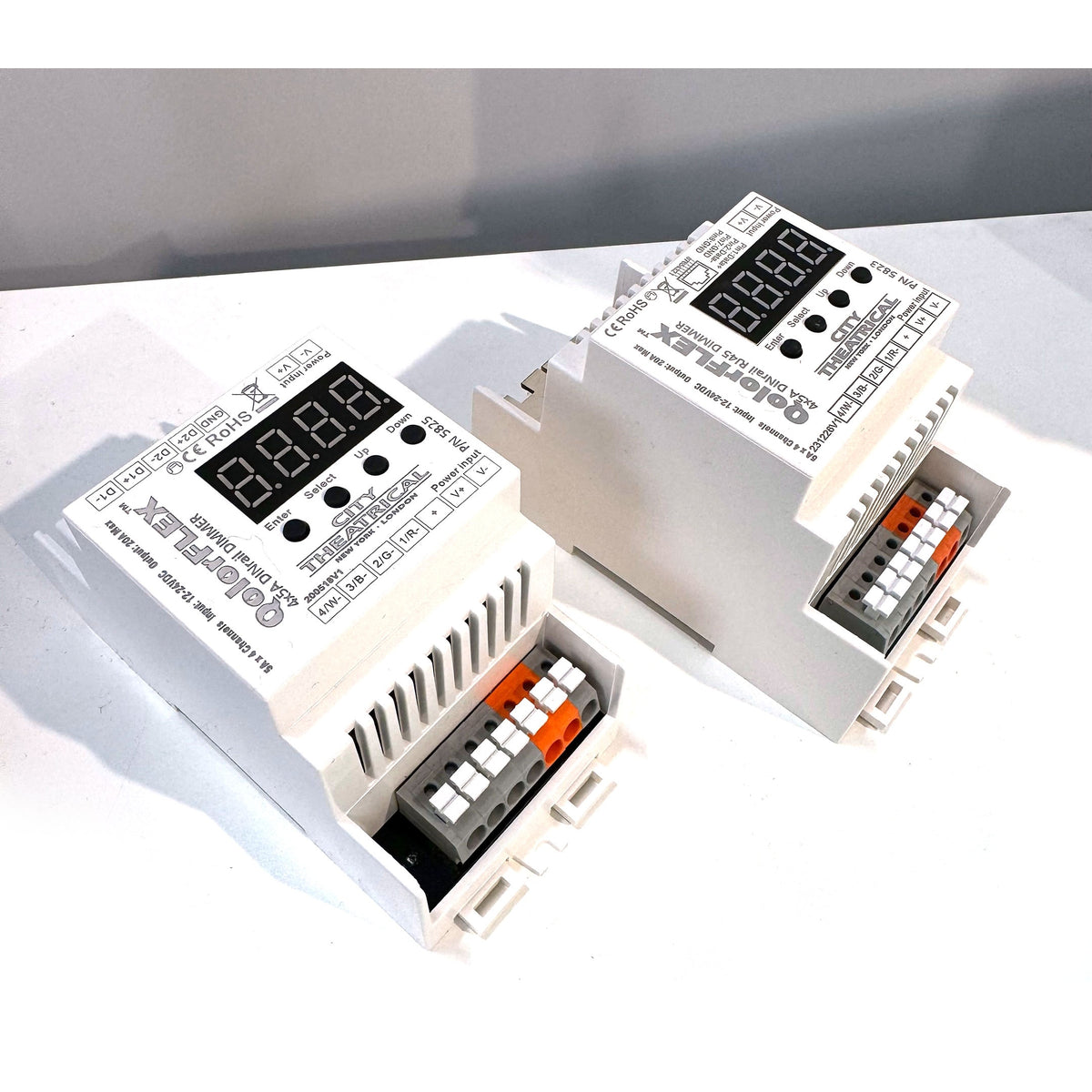 QolorFLEX 5825 and 5823 DINrail dimmers shown together with push-in terminal connectors and address displays, City Theatrical