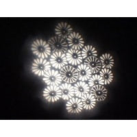 Image Multiplexer 1450 projection sample of a daisy gobo multiplied into a cluster of white flower images, City Theatrical