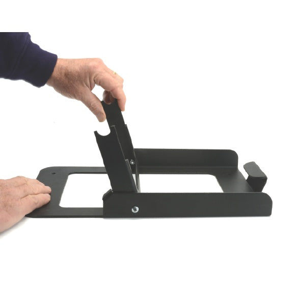 4305 ETC cyc base in use with hand raising the hinged mounting bracket upright from the floor plate, City Theatrical