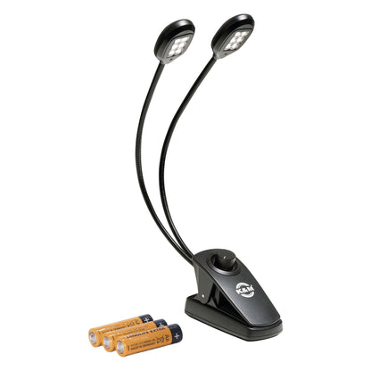 12271 Twin Head Pro music stand light front view showing LED arrays on both lamp heads, clip base with dimmer knob and three AA batteries, K&M