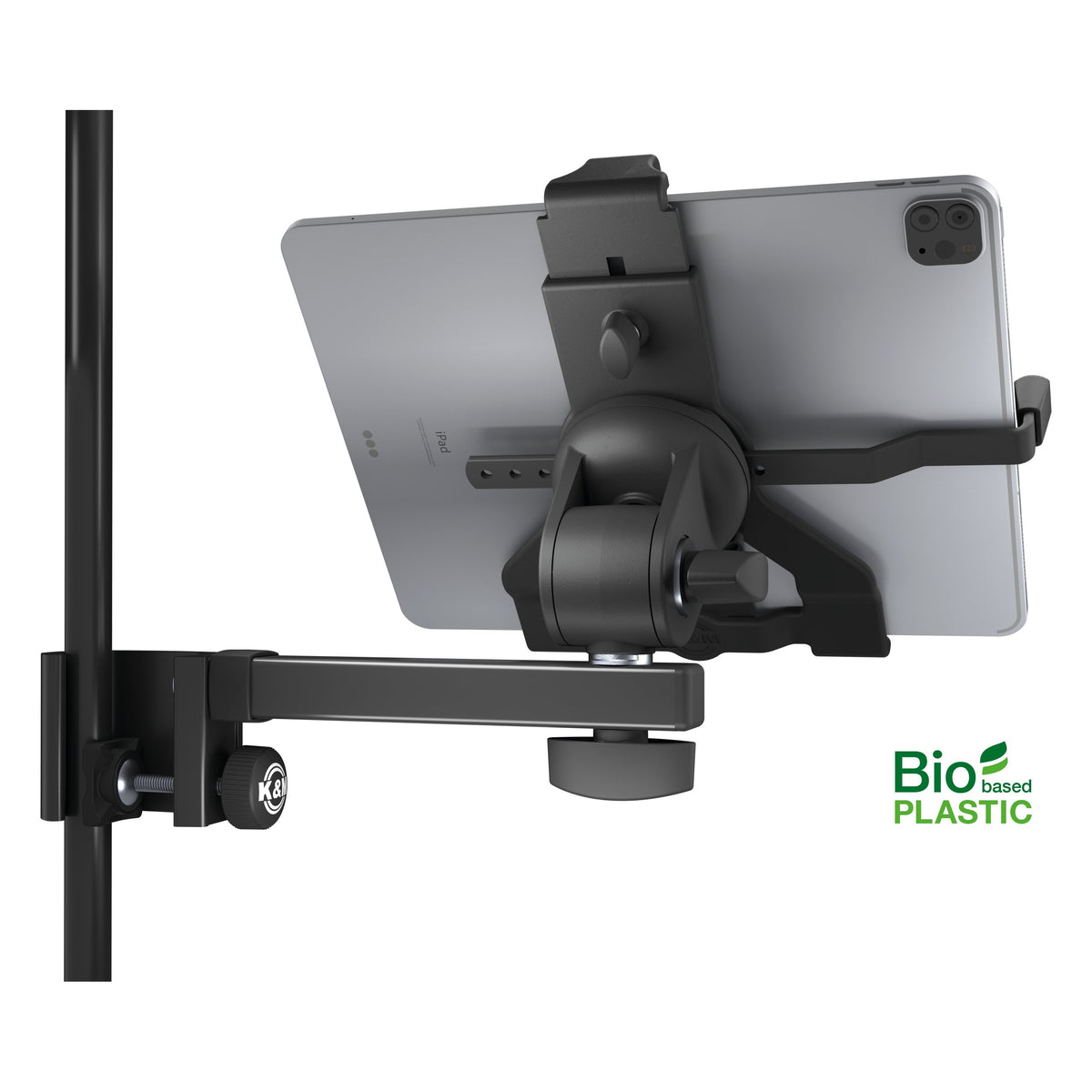 Biobased tablet holder rear view holding a tablet, showing swivel joint, tilt knob and K&M-branded clamp screw on the stand tube, K&M