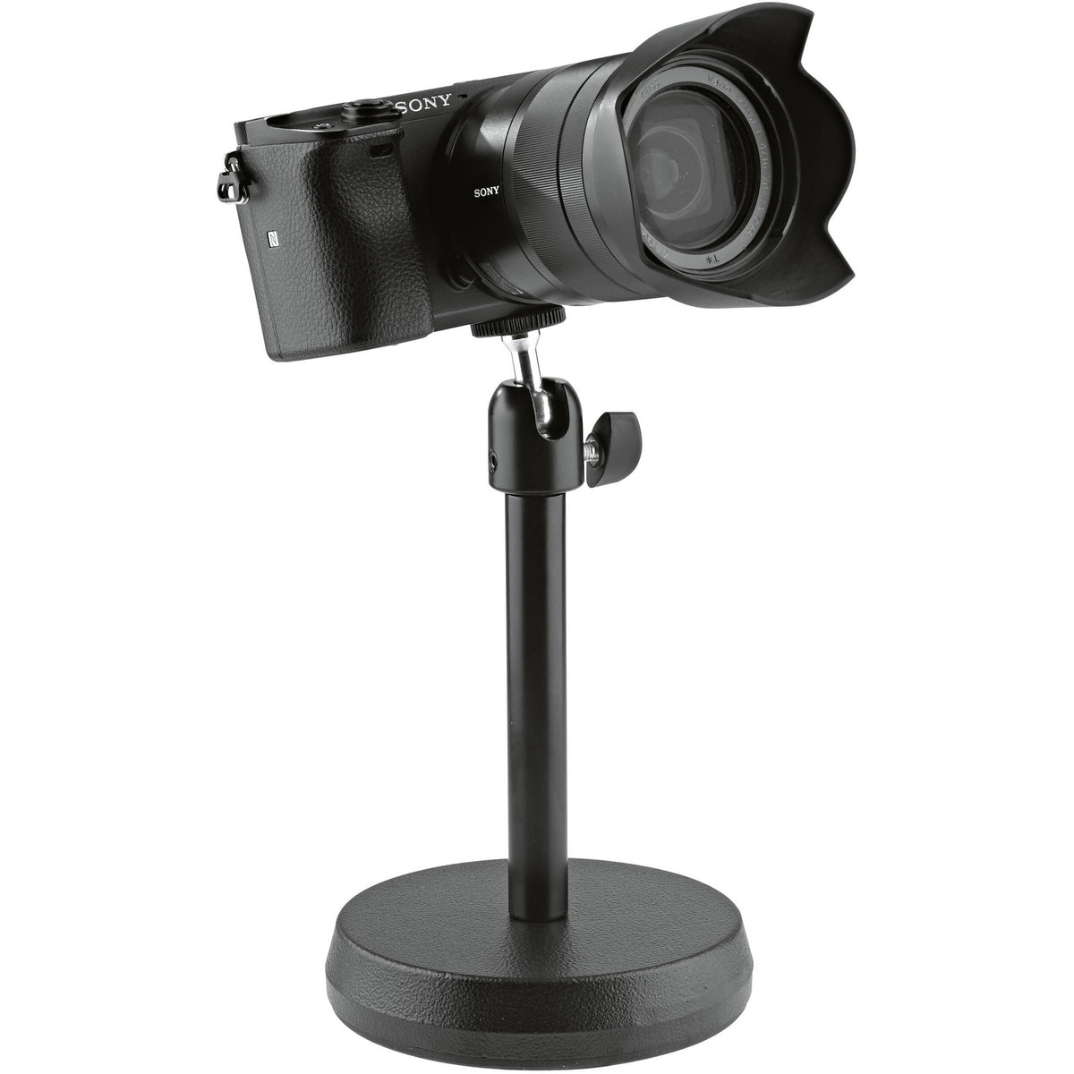 KM 19781.100.55 desktop stand holding a mirrorless camera with lens hood on the 1/4-inch tilting head, K&M