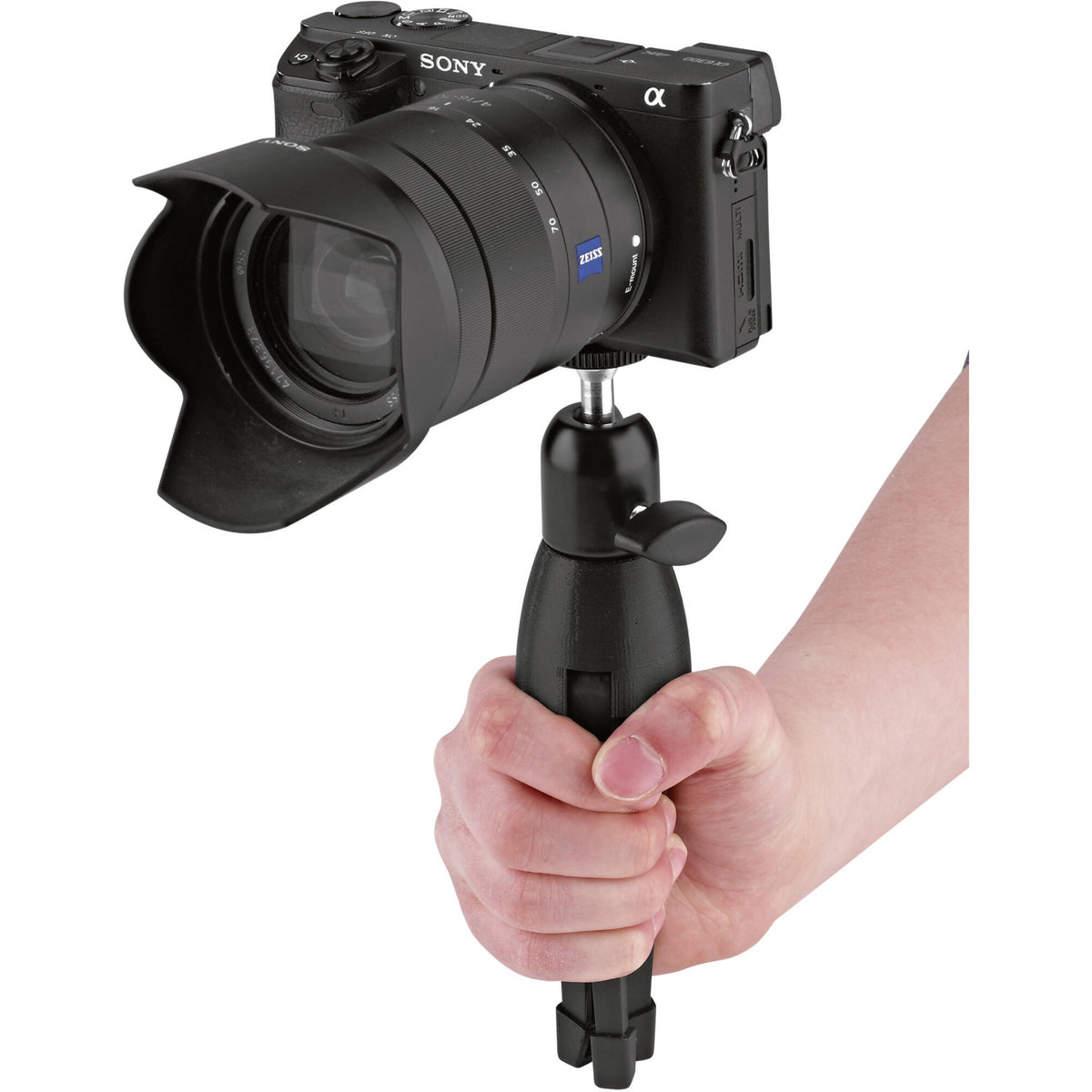 KM 19783.100.55 tripod held in hand as a grip with legs folded and Sony mirrorless camera mounted on the ball head, K&M