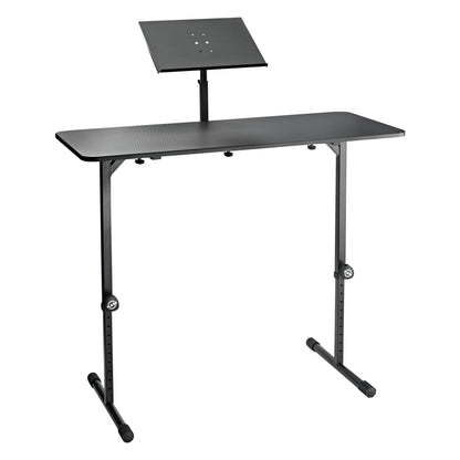 12162 DJ table extension tray in use mounted on a black DJ table with adjustable-height legs and T-shaped feet, K&M