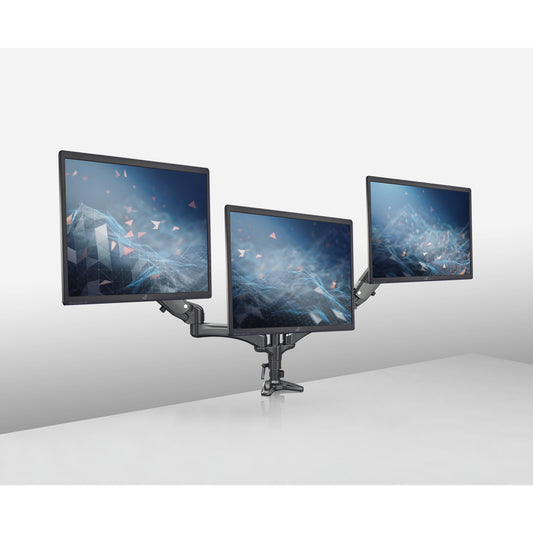 23878 triple monitor desk mount in use, clamped to a desk edge and holding three monitors at staggered angles, K&M