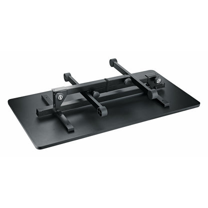 12170 folding DJ event table folded flat with legs collapsed against the underside of the black tabletop, showing hinge brackets and K&M logo, K&M
