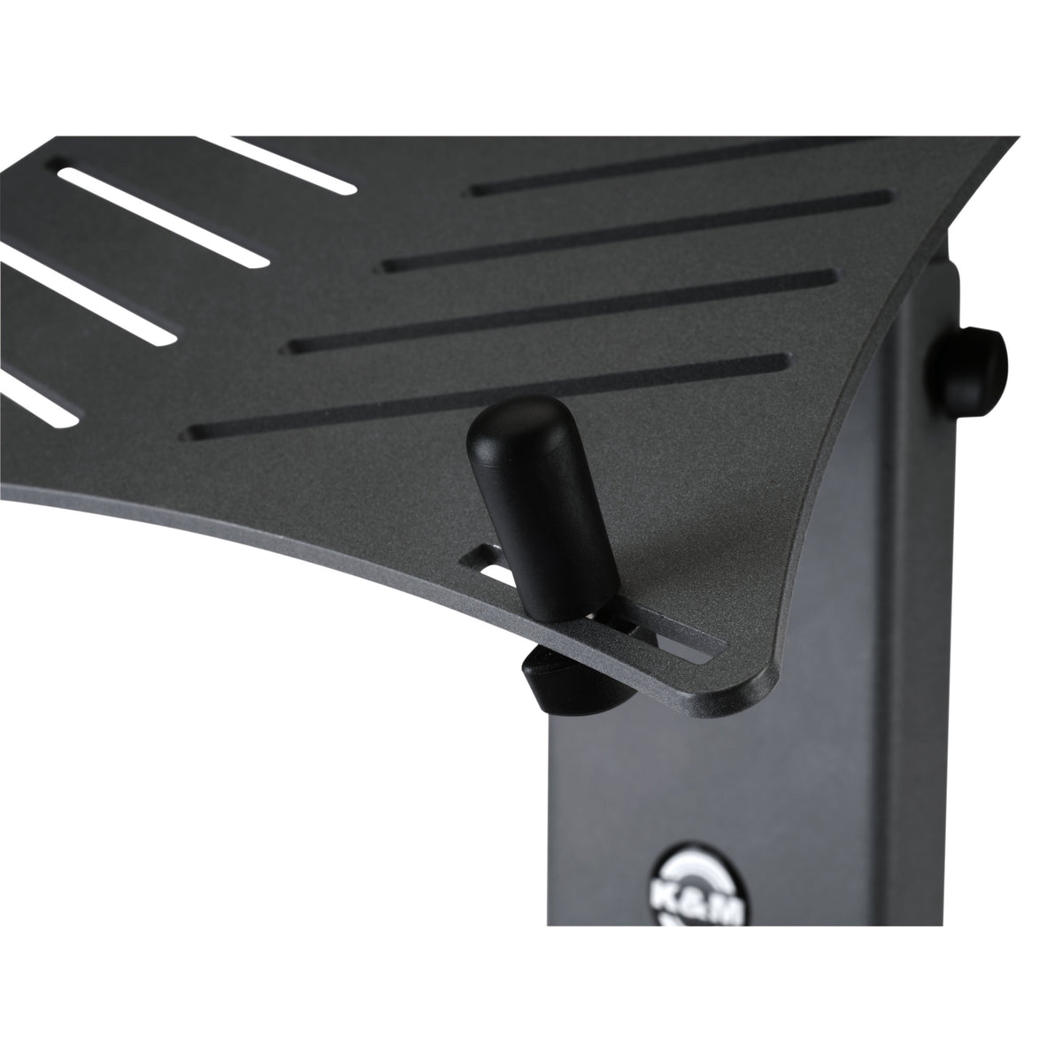 12189 XL stop pin fitted in slotted shelf of black laptop stand, close-up of pin and thumb nut beneath the plate, K&M