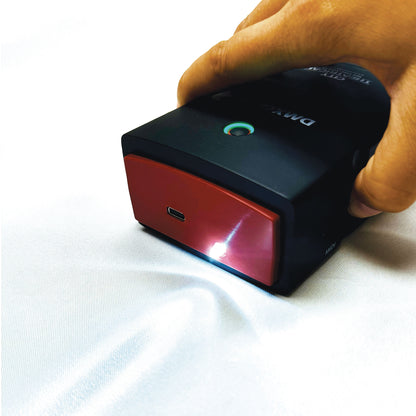 DMXcat-E 6100 top-down angle with built-in work light beam projected onto surface, City Theatrical