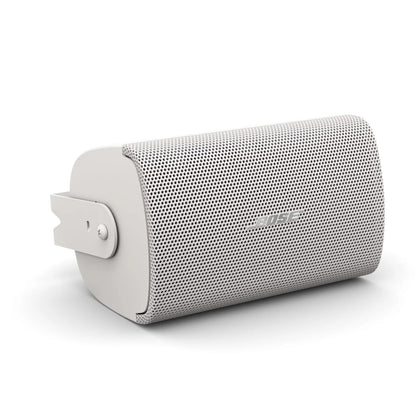 Bose AudioPack Pro S4 white surface-mount speaker at an angle with U-bracket mounting hardware attached