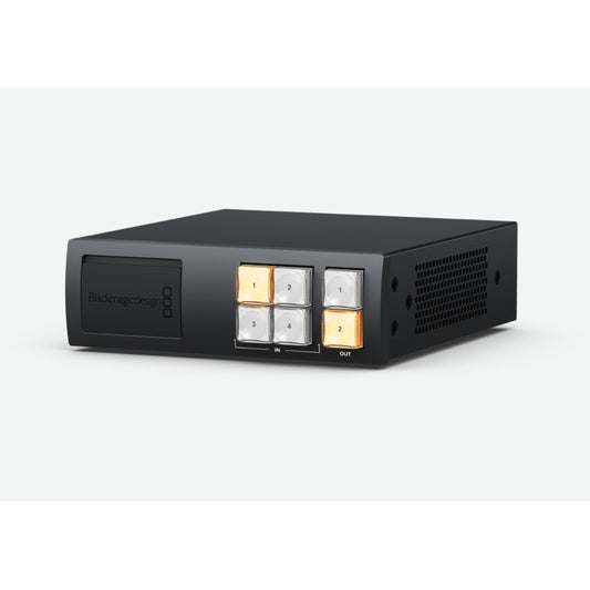 Blackmagic Design Videohub Mini 12G SDI router at an angle showing side vents and illuminated crosspoint buttons