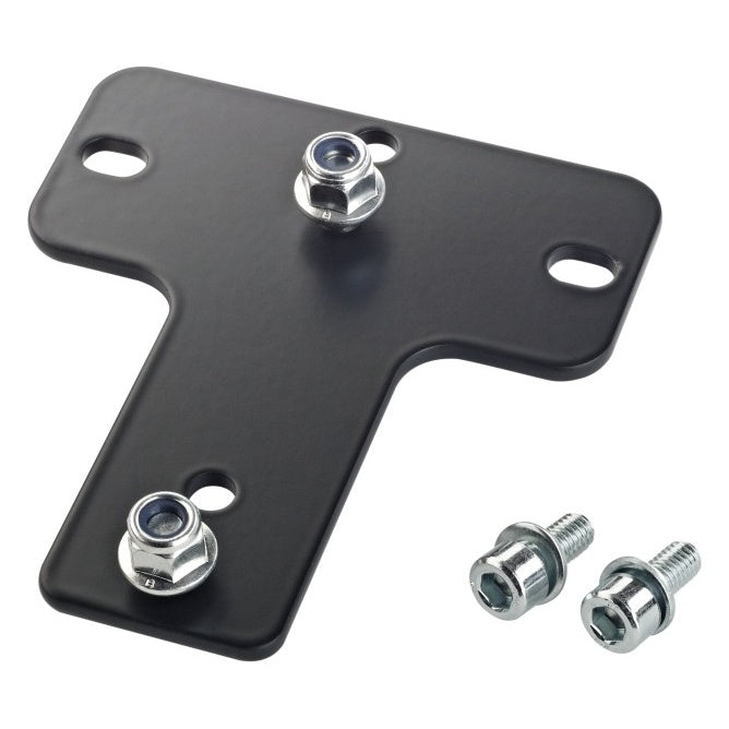 24359 T-shaped steel speaker wall mount adapter plate in black, angled top view with two nylon-insert flange nuts fitted, two slotted mounting holes and two socket-head screws with washers alongside, K&M