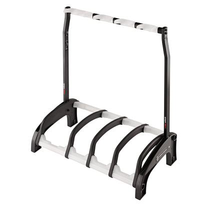 17534 Guardian 3+1 four-guitar stand empty, three-quarter front view showing black arched base cradles, white padded rails and upper neck rest bar, K&M