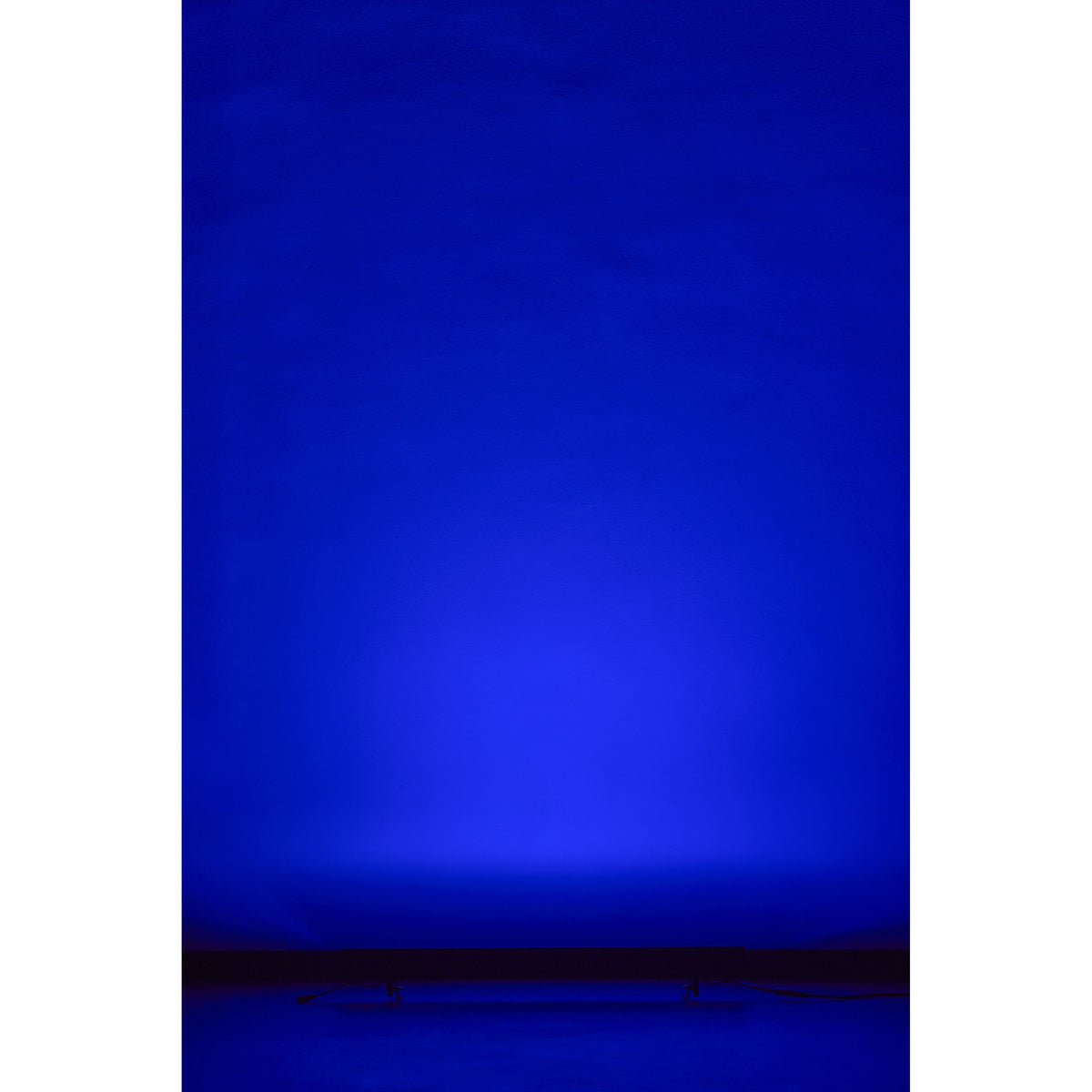 VDO Sceptron XB producing a deep blue wall wash from the floor, Martin Lighting
