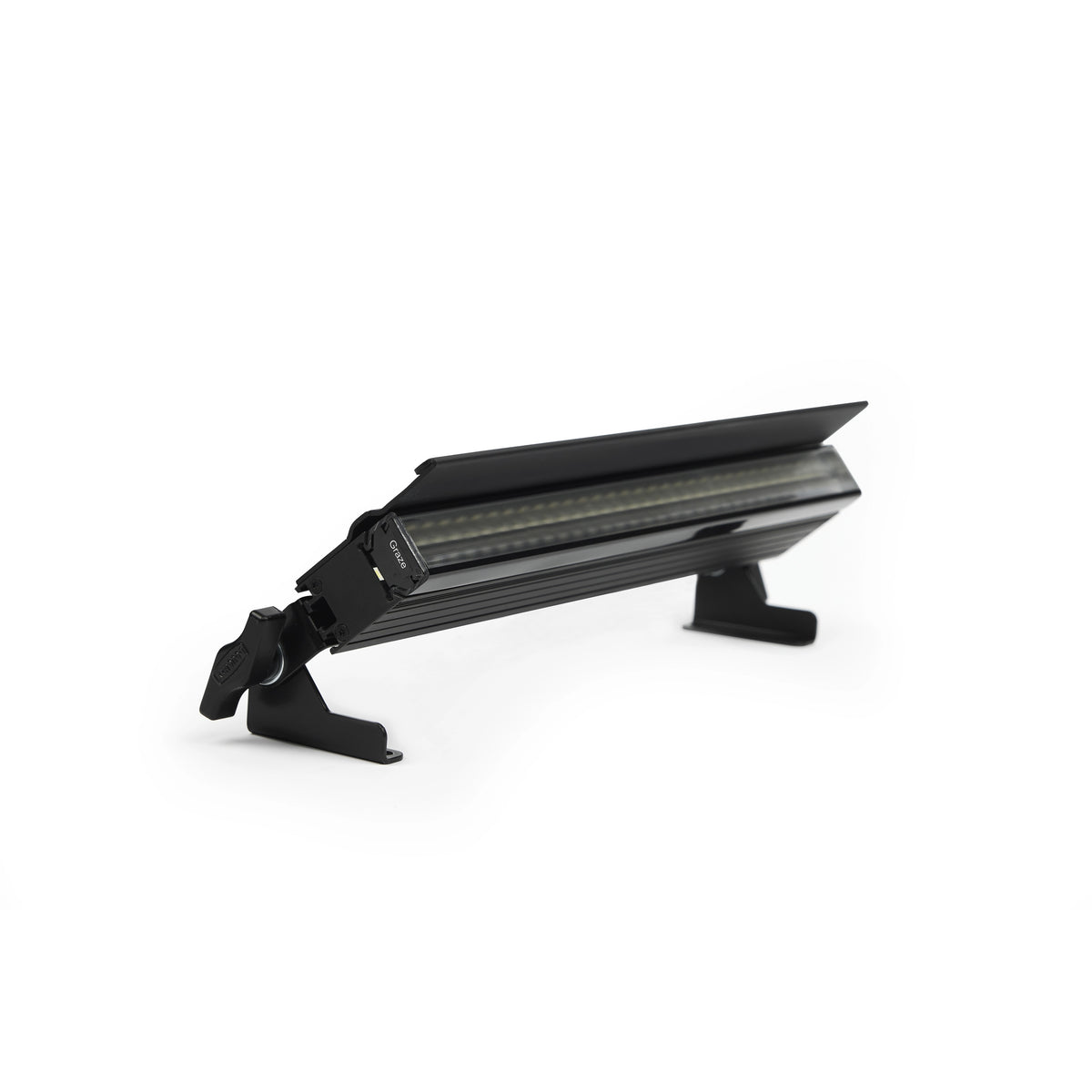 VDO Sceptron XB with Graze optic and glare shield mounted on tilting floor feet, Martin Lighting