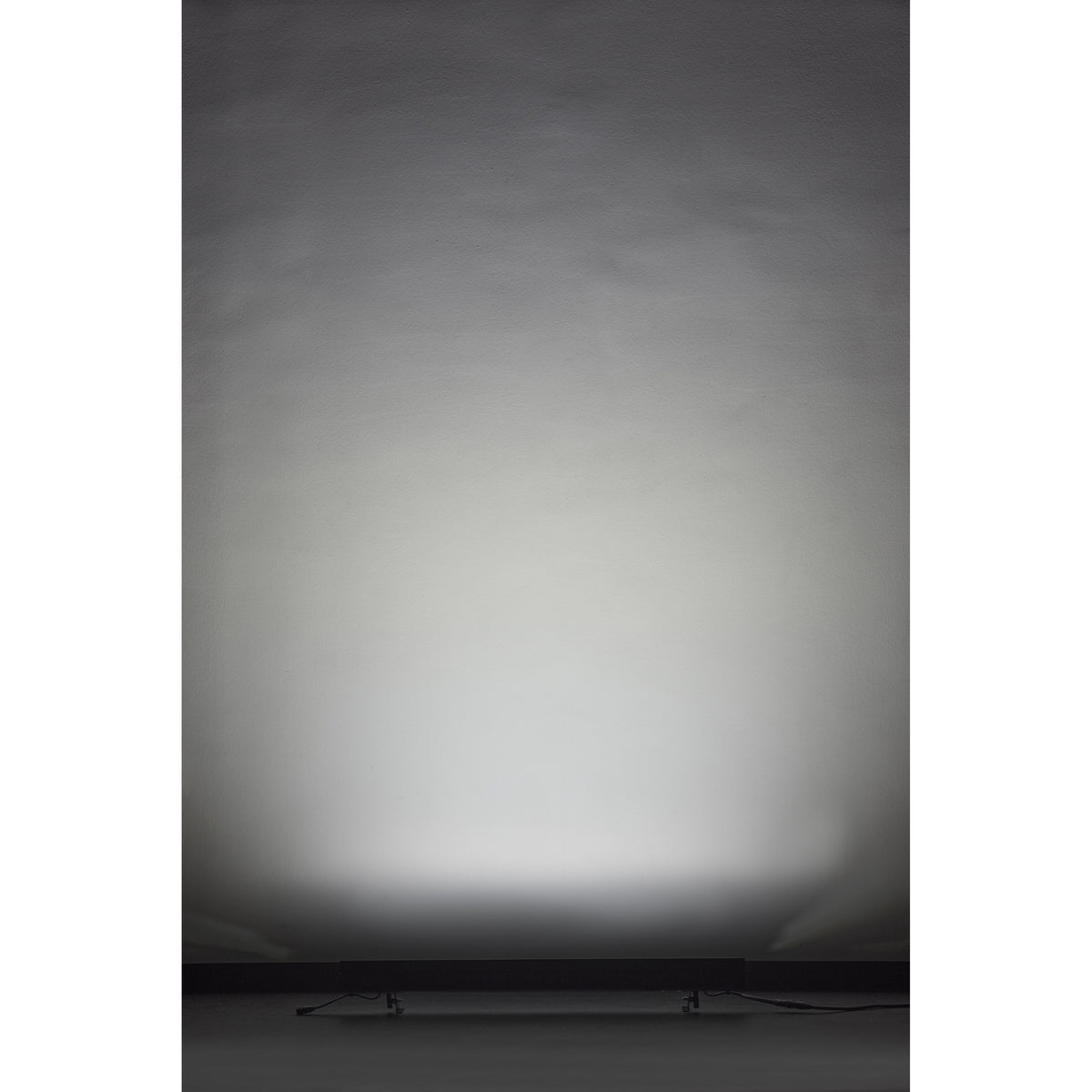 VDO Sceptron XB producing an even white wall wash from floor level, Martin Lighting