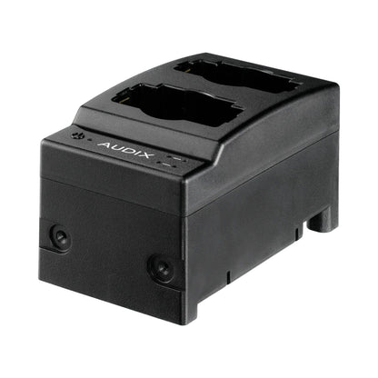 NCC2 Novacore 2-bay charge station three-quarter view showing angled black chassis with dual transmitter docking bays, Audix
