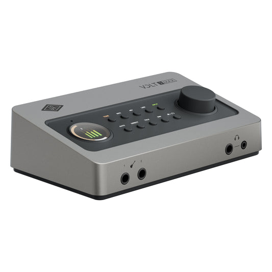 Volt 2 Max three-quarter view showing front instrument inputs, headphone outputs, angled control panel with level meter and large monitor knob, Universal Audio