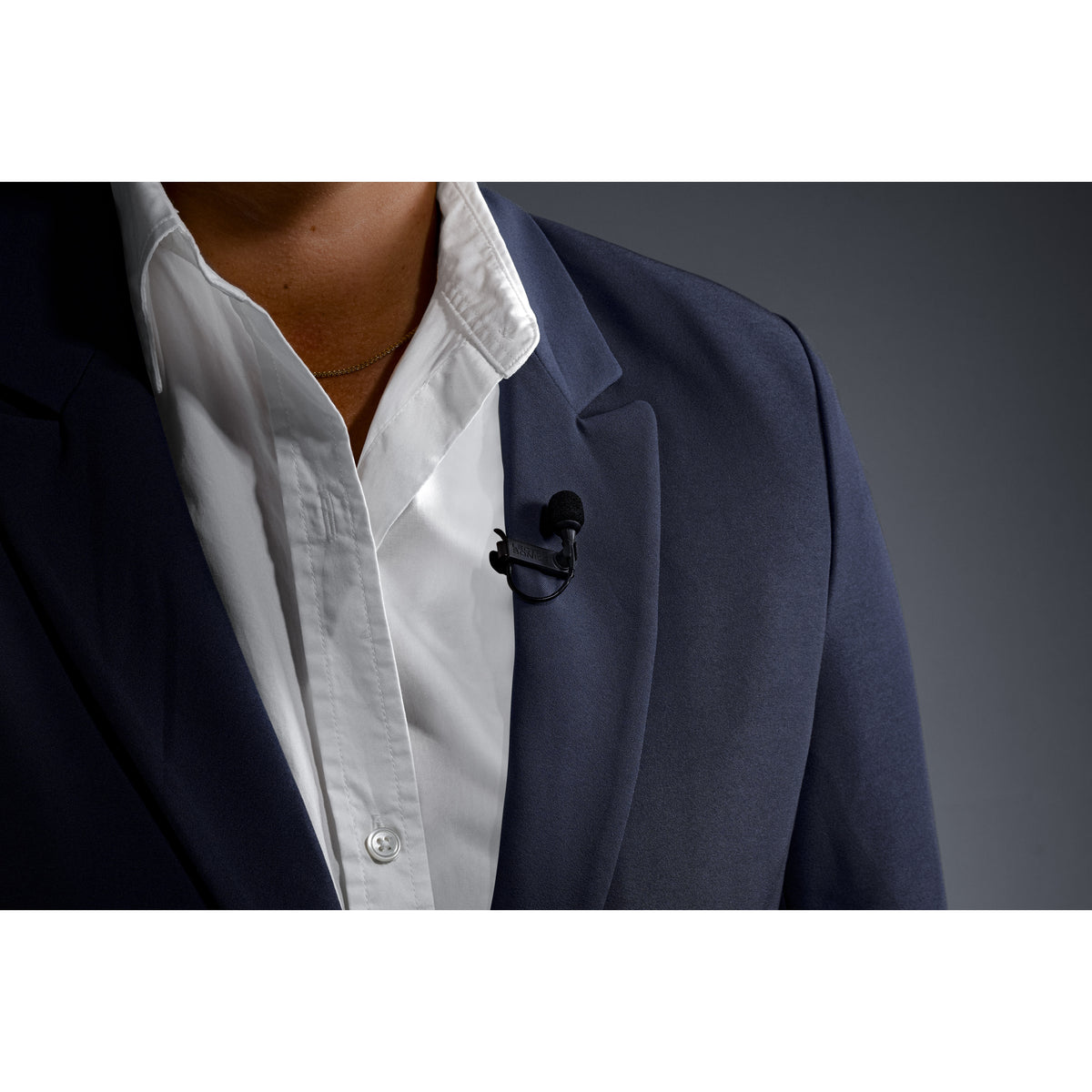 L1 Sonaura lavalier in use on suit lapel with foam windscreen fitted, Lectrosonics