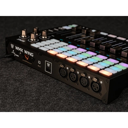 WMX318 Wolfmix Wing detail of rear I/O and lit pads with power cable connected on carpeted surface, ADJ