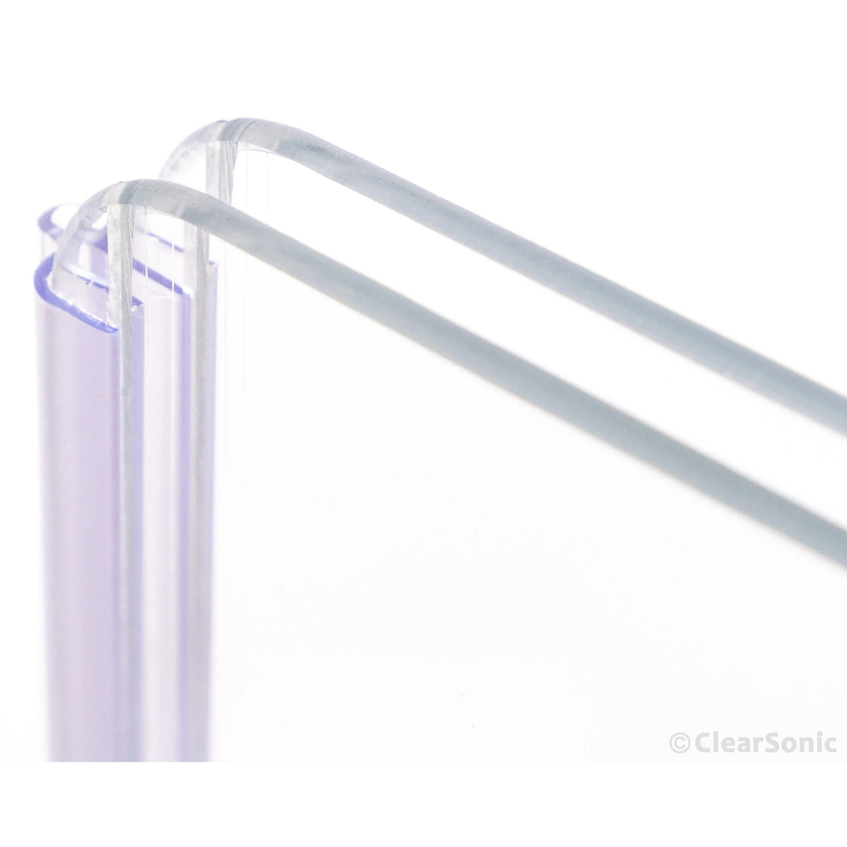 A2478 flexible hinge close-up with two acrylic panel edges held flat in the clear channel, ClearSonic
