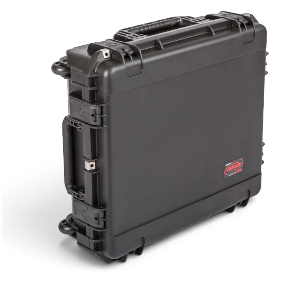 3I-2421-7BE iSeries case shown on edge with wheels down and pull handle stowed, SKB