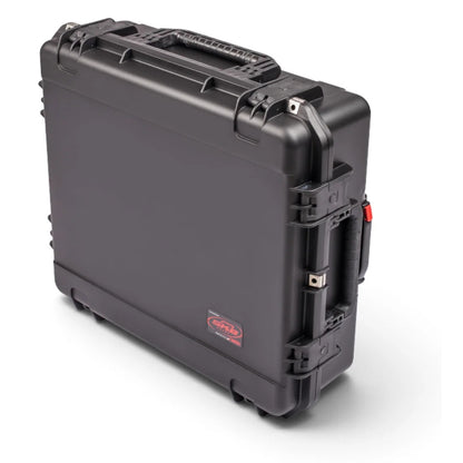 3I-2421-7BE iSeries case upright three-quarter view showing top handle, red handle release button and wheel feet, SKB