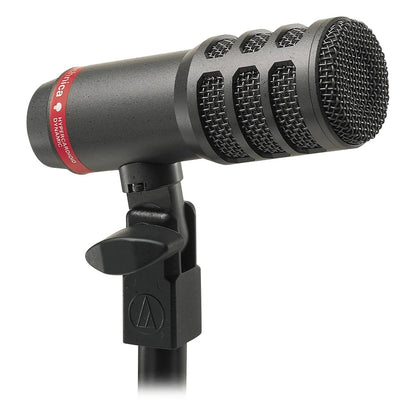 ATM25 hypercardioid dynamic kick drum mic angled three-quarter view showing vented steel grille and integrated swivel stand mount, Audio-Technica