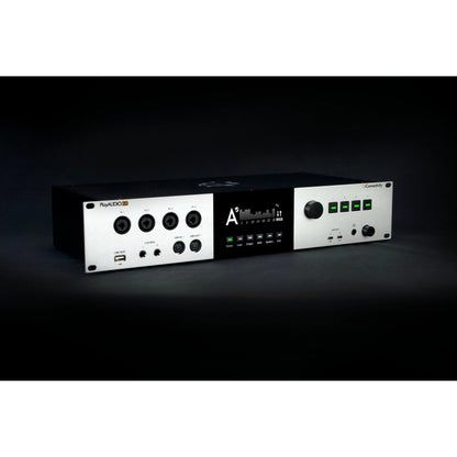 PlayAUDIO2D angled front three-quarter view on dark background showing silver faceplate, combo inputs and central display, iConnectivity