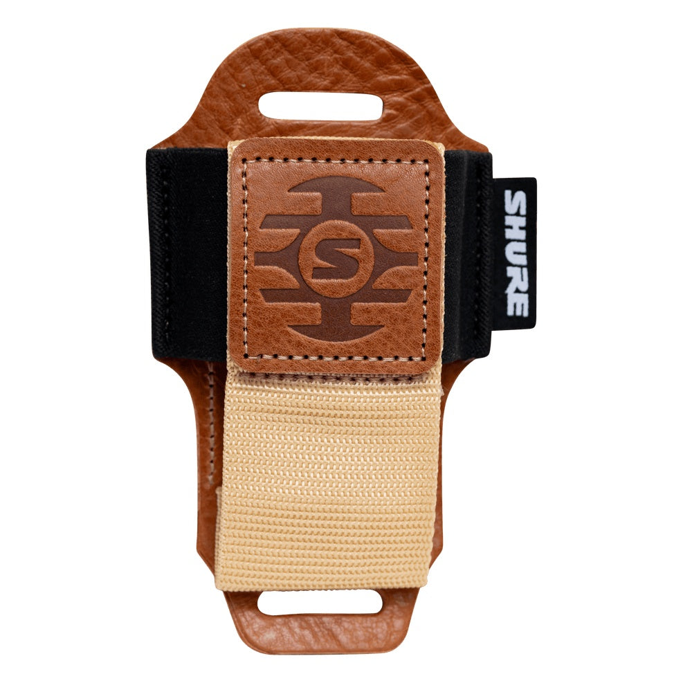 SH-BODYPACK-PTN-L bodypack pouch empty front view showing tan leather body, embossed Shure logo patch and tan webbing strap, Gator