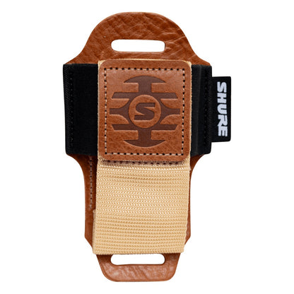 SH-BODYPACK-PTN-L bodypack pouch empty front view showing tan leather body, embossed Shure logo patch and tan webbing strap, Gator