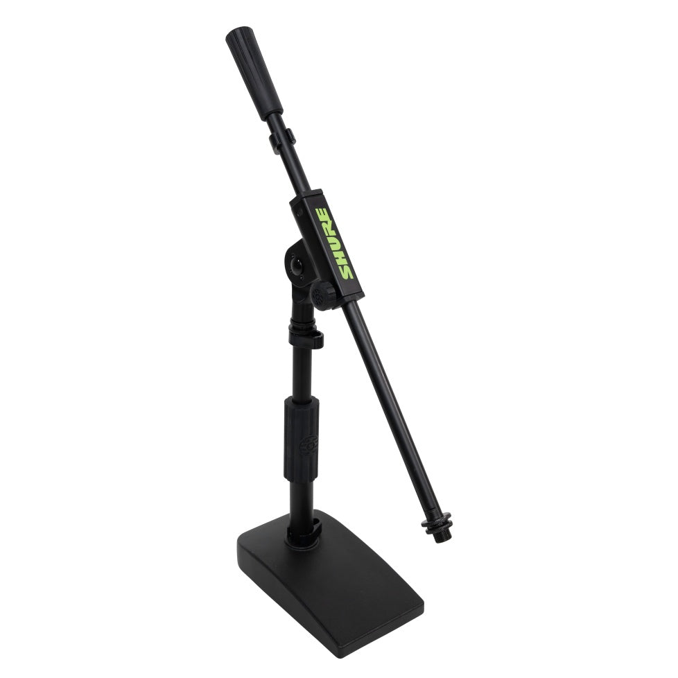 SH-DESKTOP2 desktop mic stand angled front view with boom arm raised high and green Shure logo on the boom clutch, Gator